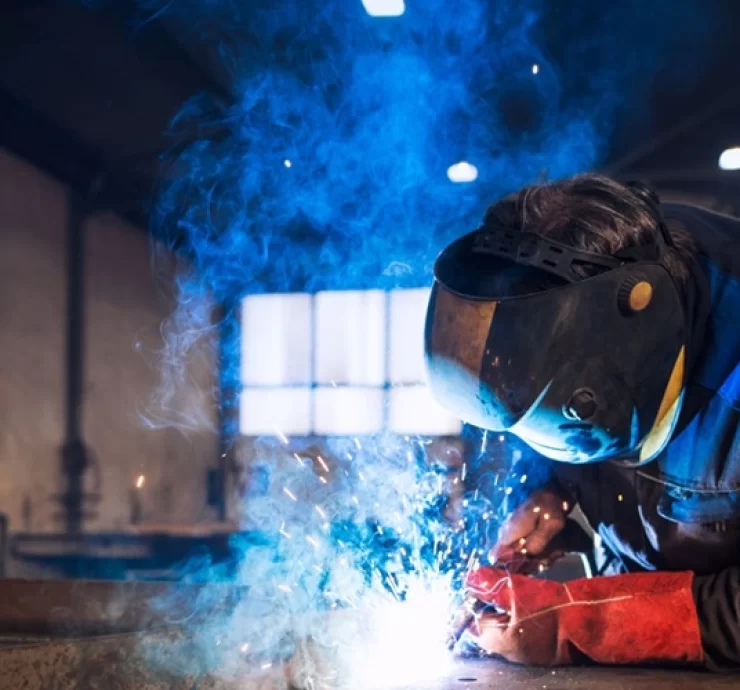 close-up-view-worker-welding-metal-construction-industrial-workshop